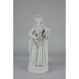 A Parian ware figure of a woman her dress full of grapes (a/f) 32cm