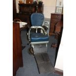 A 20th century dentist's chair with circular swivel base, marked MCO Ltd, England, (a/f)