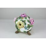 A Victorian porcelain snowball vase, decorated with bocage roses over five small openings (a/f) 15cm