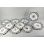 A Coalport porcelain 'Sandringham' pattern part dessert service, with floral decoration within a