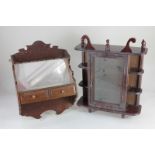 A mahogany collectors wall unit, the glass panel door enclosing three shelves, with three corner