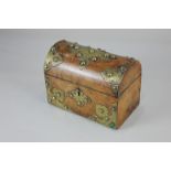 A Victorian walnut and brass mounted box, of domed casket form, with fabric lined interior, 16.5cm