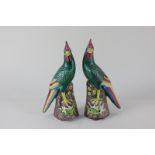 A pair of Chinese pottery models of brightly coloured birds on pierced bases (a/f) 20cm high