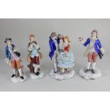 A collection of four 19th century style modern porcelain figures, comprising a dancing couple, a