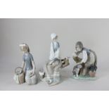Three Lladro porcelain figures of a woman seated on a branch with a bird, a girl with a dog and a