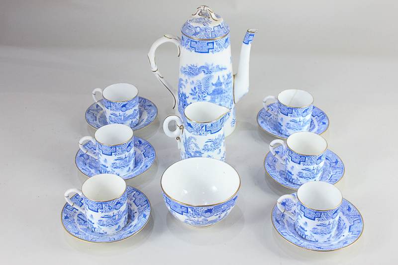 A Royal Worcester porcelain coffee set for six, in the blue and white Pagoda pattern, comprising