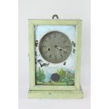 An American wall or mantle clock with painted case, face and glass, paper label inside, the movement