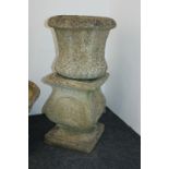A pair of stone composition garden planters on square baluster bases, 35cm