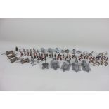 A collection of miniature metal models of soldiers, chariots, Viking ships, warriors, horses, etc.