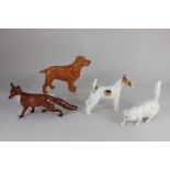 A Beswick model of a fox, 13.5cm high, together with two Beswick models of dogs; a wire fox