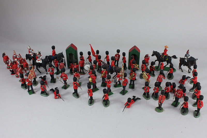 A collection of Britains Ltd and similar plastic figures, including Queens Guards, Canadian