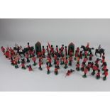 A collection of Britains Ltd and similar plastic figures, including Queens Guards, Canadian