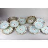 A late 18th / 19th century Derby porcelain part dessert service, decorated sprays and borders of