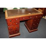 A Victorian mahogany pedestal desk with an arrangement of nine drawers, on plinth base (a/f), 114cm