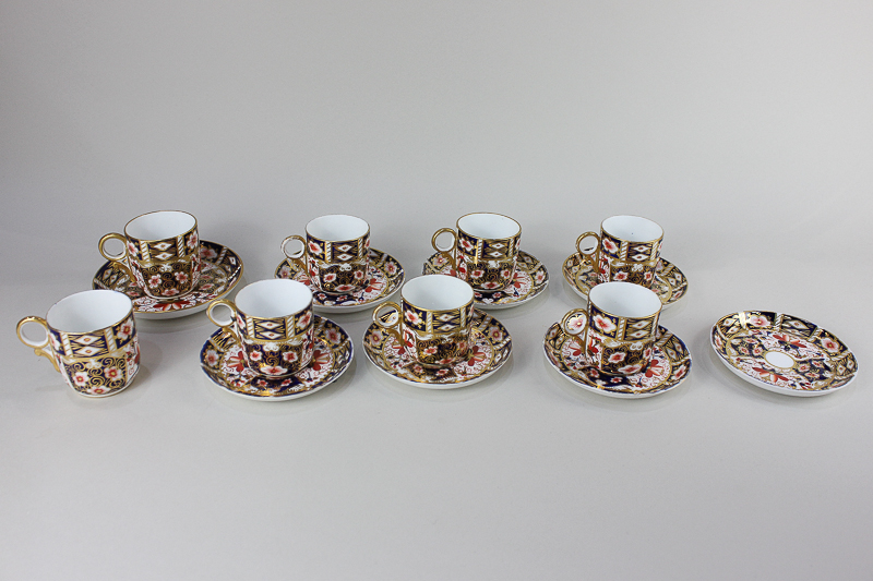 A set of six Royal Crown Derby Imari porcelain coffee cups and seven saucers, together with two