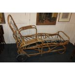 A bamboo garden recliner with sprung supports and adjustable back, on wheels, 140cm
