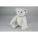 A Steiff Collectors Bear, No. 662683, limited edition 2008, in white mohair with ear stud, wearing a