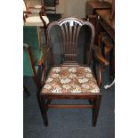 A George III style carver dining chair, with pierced vase back, scroll arms, drop in upholstered