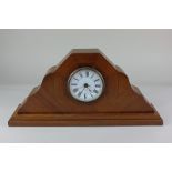 A mahogany mantle clock, by repute made at Westlands Aircraft factory, the dial and movement