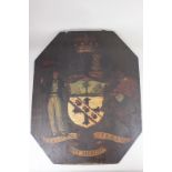 A painted wooden armorial, of octagonal form, 'Palmam Qui Meruit Ferat' lion with flag and man