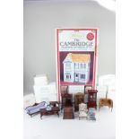 A Whitney The Cambridge Charming Victorian style wood dollhouse kit, boxed and unmade, together with