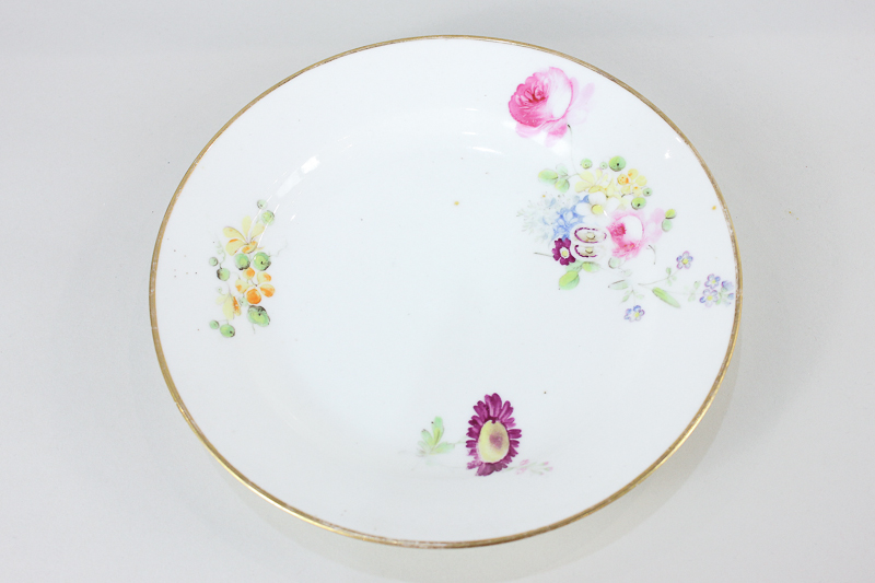 A Swansea porcelain plate, hand painted with floral sprays, 20cm diameter, label to base 'Sir Leslie