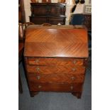 A 20th century mahogany bureau, with fall front enclosing pigeon holes and small drawer, above