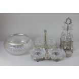 A four piece glass cruet set on plated stand, and a metal mounted glass bowl, together with a two