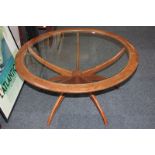 A G Plan teak 'spider' coffee table designed by Victor Williams, with circular glass top, circa