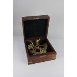 A Nauticalia brass sextant in brass bound wooden box, 23cm wide, with instructions