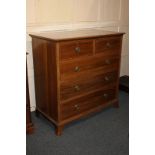 An Edwardian inlaid mahogany chest of two short over three long drawers, with satinwood banded top