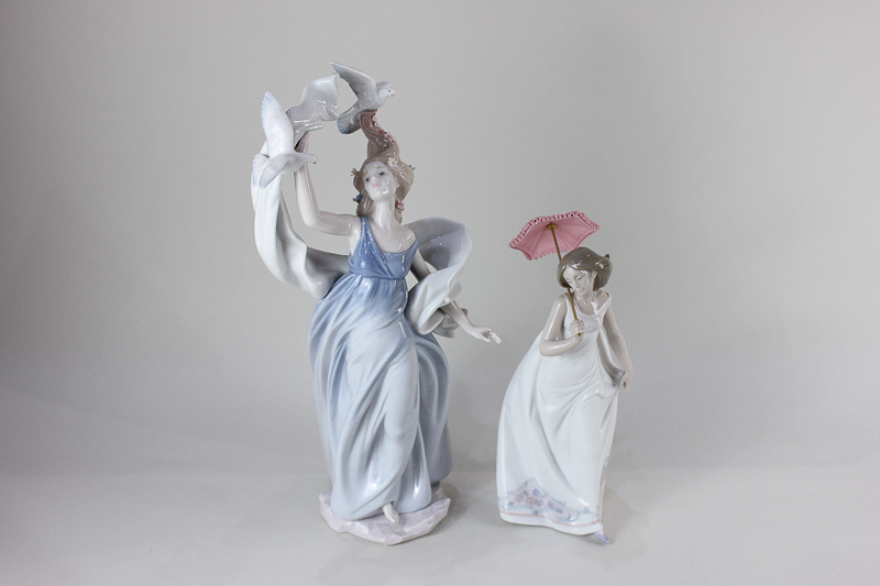 A Lladro Millennium Inspiration Collection porcelain figure of a woman, with doves and windblown