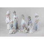 Eight Lladro porcelain figures of a children's nativity, tallest 21cm