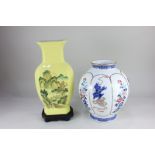 A modern Chinese porcelain baluster vase, decorated with panels of fo dogs and flowers, character