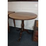 A George III style circular oak tea table with tilt top, on baluster tripod base, 77cm