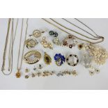 A small collection of costume jewellery, to include brooches, pendants, chains and ear studs