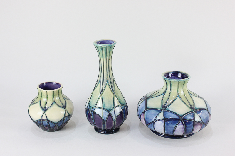 Three Moorcroft pottery Indigo pattern vases, in original boxes, tallest 16cm high