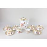 A Hammersley & Co porcelain coffee set for six, decorated with floral sprays and gilt embellishment,