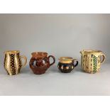 Four French Faience pottery jugs, in various patterns & sizes, tallest 14cm high