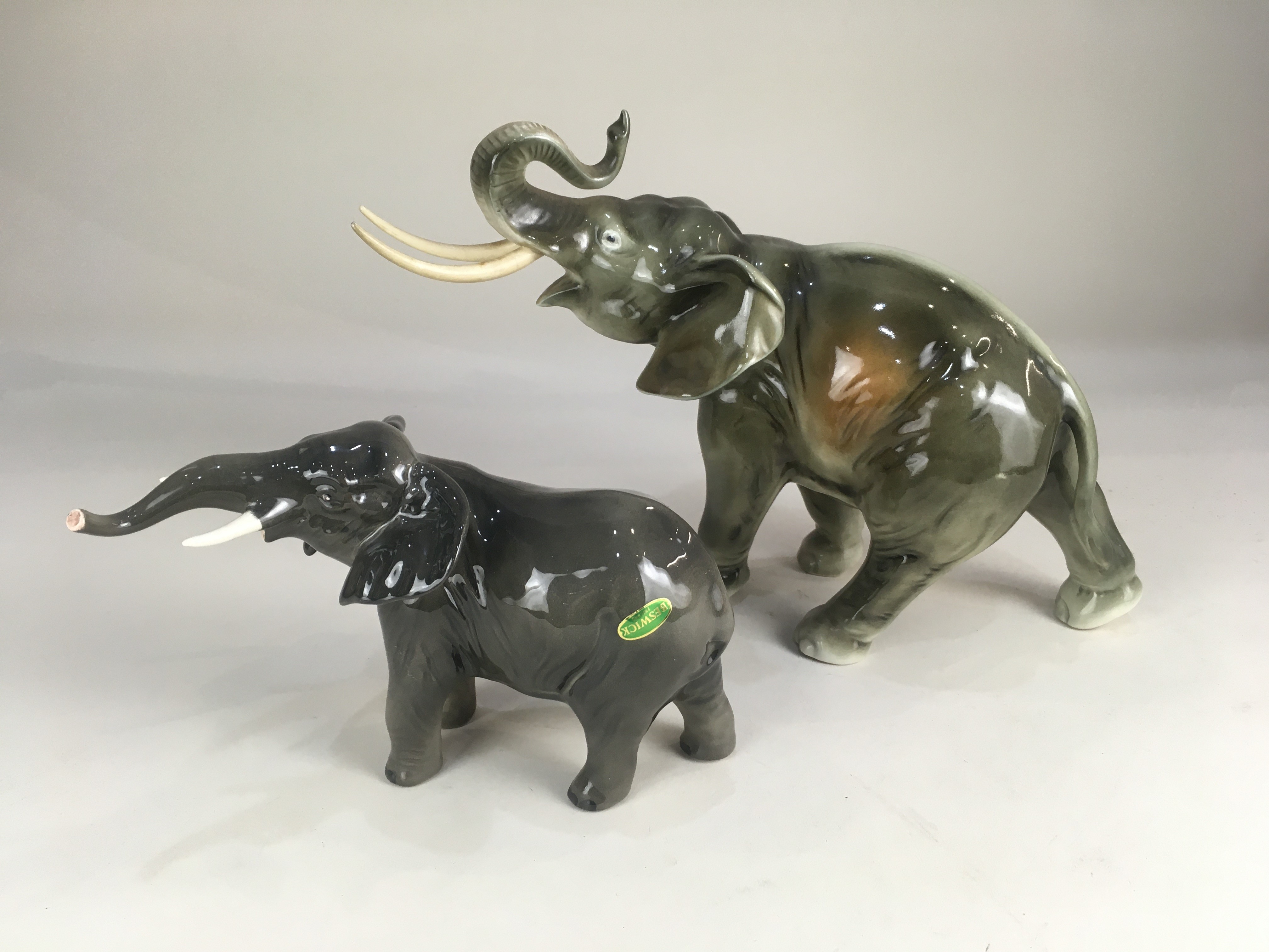 A Beswick porcelain model of an elephant, 12.5cm high, together with a Royal Dux model of an