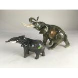 A Beswick porcelain model of an elephant, 12.5cm high, together with a Royal Dux model of an