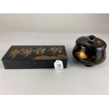 A Japanese rectangular black lacquered box, with gilt figural decoration, the interior marked 932/1,