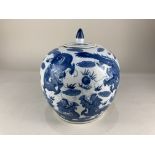 A Chinese blue and white porcelain ginger jar and cover, of bulbous form, decorated with dragons
