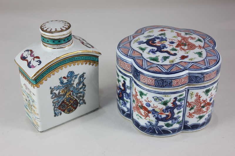 A Japanese porcelain pot and cover, lobed circular form, decorated with dragons in the Imari