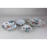 A collection of three various Chinese porcelain pedestal dishes, decorated with figures, flowers and