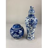 A Chinese porcelain blue and white ginger jar and cover, of bulbous form, decorated with prunus
