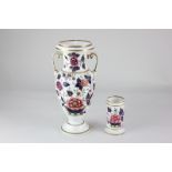 A Victorian porcelain two handled pedestal vase, with floral decoration and gilt embellishments,