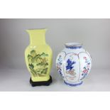 A modern Chinese porcelain baluster vase, decorated with panels of Fo dogs and flowers, character