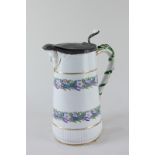 A Victorian porcelain jug, the handle with overlaid snake design, the body with floral borders and a
