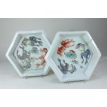 A pair of Chinese glazed pottery hexagonal shaped dishes decorated with fish, on white ground, marks